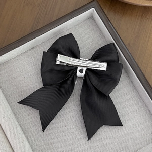 Sweet black grosgrain bow hair clip with white center on silver metal alligator clip