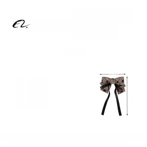 Detail view of British style plaid bow hair clip with size 13x18cm and weight 13.1g