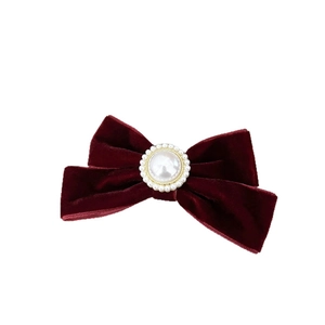 Elegant burgundy velvet bow hair clip with central pearl accent and vintage gold trim