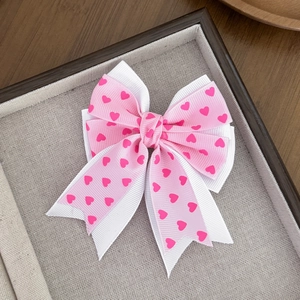 Sweet pink and white layered bow hair clip with heart prints for girls' accessories