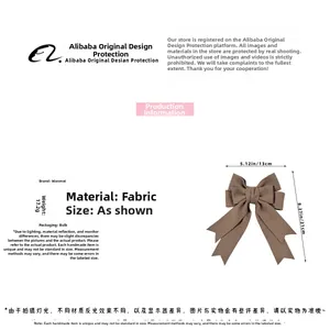 Detail view of coffee-colored fabric bow hair clip showing 13x21cm size and 17.2g weight