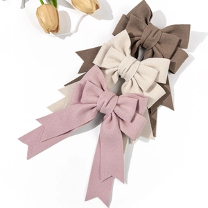 Elegant vintage bow hair clips in velvet fabric with long ribbons in three colors