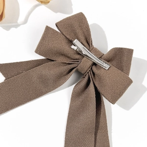 Elegant coffee brown bow hair clip with textured fabric and vintage French style hair accessory