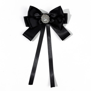 Detail of elegant black satin bow tie with sparkling crystal center for JK shirts