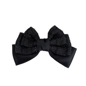 Pince à cheveux élégante avec double nœud noir en tissu texturé et finition satin