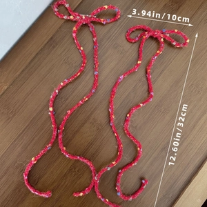 Handmade red knitted bow hair clips with colorful flecks in balletcore style for women