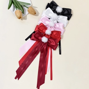 Elegant bow hair clips with white fur balls and long satin ribbons in multiple colors