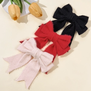 Elegant solid color plush velvet bow hair clips in pink white, red, and black colors