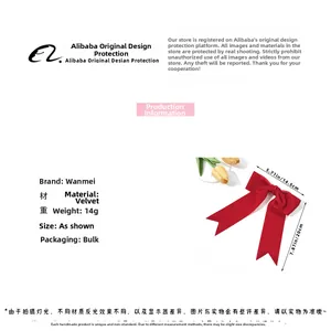 Detail view of a 14g red velvet bow hair clip showing material specifications and size