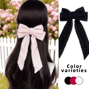 Elegant wool bow hair clip with long ribbons for women, available in pink, red, and black