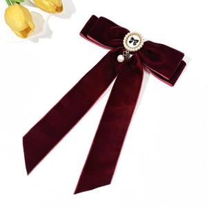 Elegant wine red velvet bow hair clip with pearl pendant and golden logo center piece