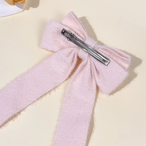 Elegant pink plush bow hair clip with soft faux mink fur and long flowing ribbons