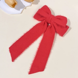 Elegant red faux fur bow hair clip with long ribbons for autumn and winter hair styling