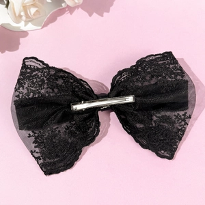Elegant oversized black lace bow hair clip for women with detailed floral embroidery texture