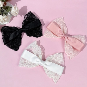 Elegant oversized lace bow hair clips in black, pink, and white for a Lolita style look