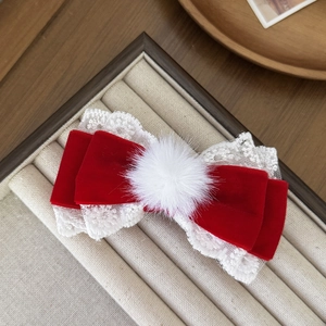 Elegant red velvet bow hair clip with white plush ball and delicate lace trimming