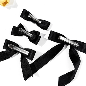 Set of four black satin bow hair clips with silver alligator clips for women and girls