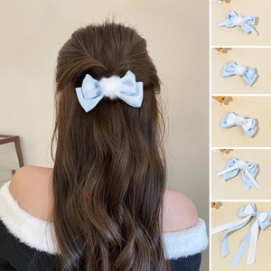 Elegant blue satin hair bow with white pom-pom detail for girls stylish hair accessories
