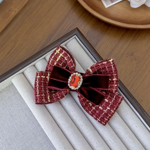 Elegant wine red tweed bow hair clip with large red gemstone and rhinestone details