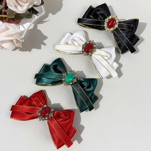Bohemian bow hair clips with gemstone embellishments in black green red and white