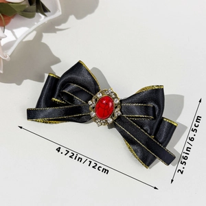Detail view of Bohemian bow hair clip with red gemstone and 12cm size dimensions