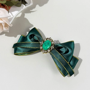 Bohemian dark green bow hair clip with vintage turquoise and crystal details