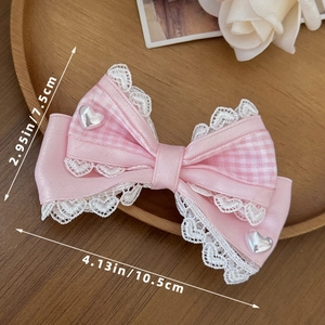 Detailweergave van de 10,5 cm roze Lolita-strik met kant en parels voor meisjes
