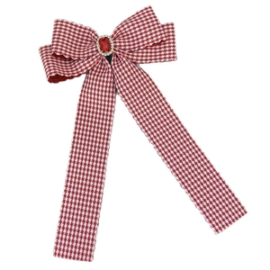 Elegant red houndstooth bow hair clip with rectangular ruby gemstone and sparkling crystals