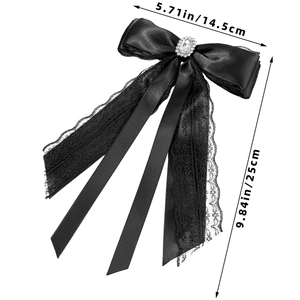 Detailed view of lace bow hair clip with rhinestone and dimensions 14.5cm by 25cm