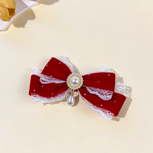 Elegant red velvet hair bow with white lace edges, pearl pendant and rhinestone accents