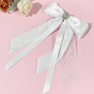 Elegant white lace bow hair clip with crystal embellishment and long ribbon for women