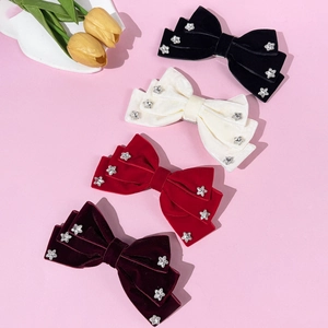 Elegant velvet bow hair clips set with sparkling star rhinestones in various colors