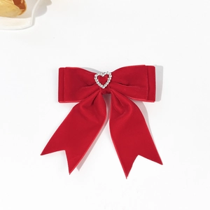 Elegant red velvet bow hair clip with a sparkling rhinestone heart center for women