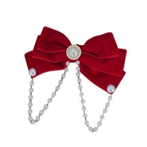 Elegant red velvet bow hair clip with large pearl center and dangling pearl chains