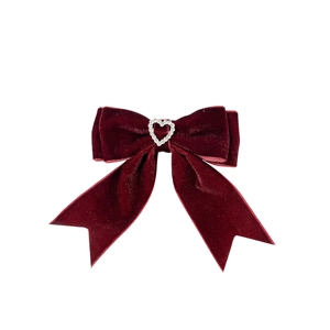 Elegant deep red velvet bow hair clip with a sparkling rhinestone heart decoration