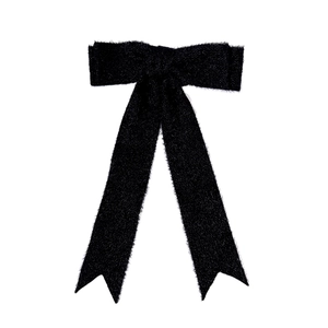 Elegant black wool bow hair clip with long streamers for a retro winter fashion style