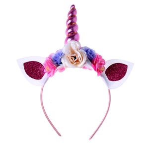 Unicorn headband for kids with pink horn, glitter ears, and floral fabric decorations