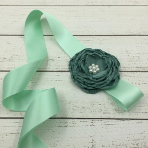 Mint green satin belt for children and maternity photos with dark teal fabric flower and pearls