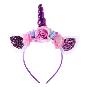 Kids unicorn headband with purple spiral horn, colorful flowers and shiny sequin ears