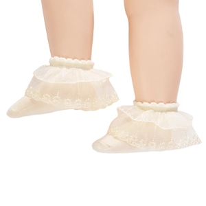 Detail of baby lace socks featuring breathable mesh, embroidered flowers and ruffled cuffs