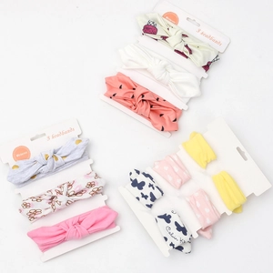 Lot de trois bandeaux élastiques en coton pour bébé avec oreilles de lapin et fleurs
