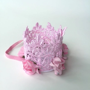 Detail of pink lace crown baby headband featuring soft fabric roses and elastic band