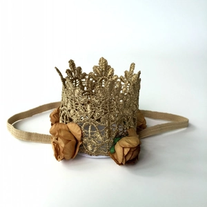 Close-up of golden lace crown headband with brown fabric roses for baby girls