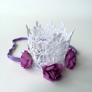 Detail of baby crown headband with lace texture and burgundy fabric rose flowers