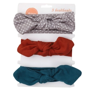 Lot de trois bandeaux pour bébé avec nœuds en gris à pois, rouge et sarcelle sur carte