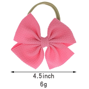 Detail eines 4,5-Zoll-Baby-Stirnbands mit rosa Waffel-Doppelschleife und Nylonband