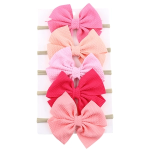 5er-Pack rosa Schleifen-Stirnbänder für Babys mit elastischen Nylonbändern und Strukturstoff