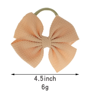 Minimalistisches 4,5-Zoll-Baby-Stirnband mit pfirsichrosa Waffelschleife und grünem Haargummi
