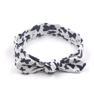 Bandeau bébé blanc en tissu élastique avec motifs papillons bleus et nœud oreilles de lapin