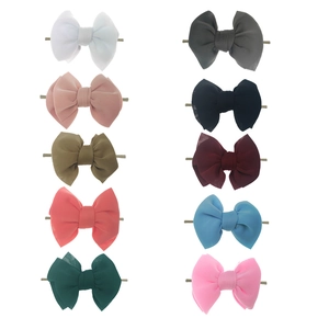 Set of 10 colorful puffy bow headbands for baby girls made of soft space cotton fabric